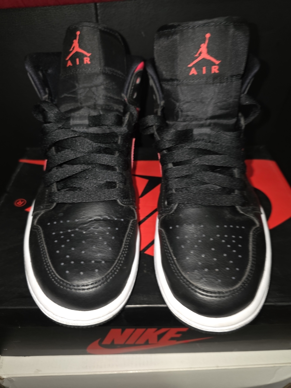 These are Nike Air Jordan 1 Mid Siren Red sneakers for Women